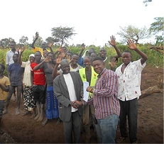 Community celebrating the completion of a clean water project