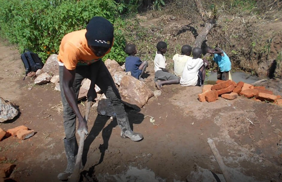 Volunteer assisting with a community clean water project