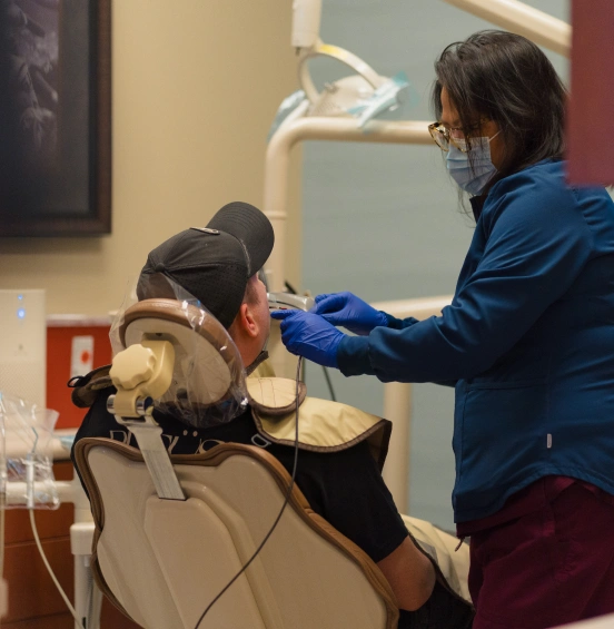 Dentist providing emergency dental care