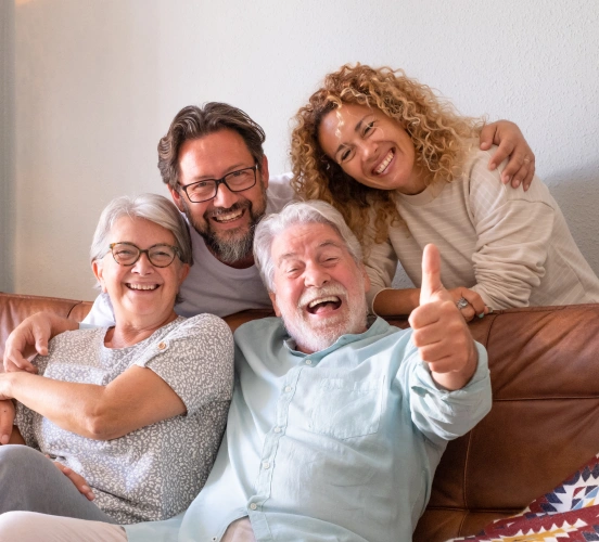 Happy family smiling together with healthy smiles