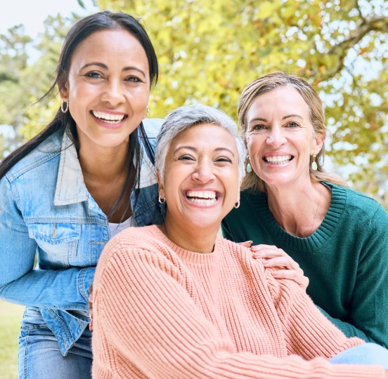 Family enjoying healthy smiles after dental care