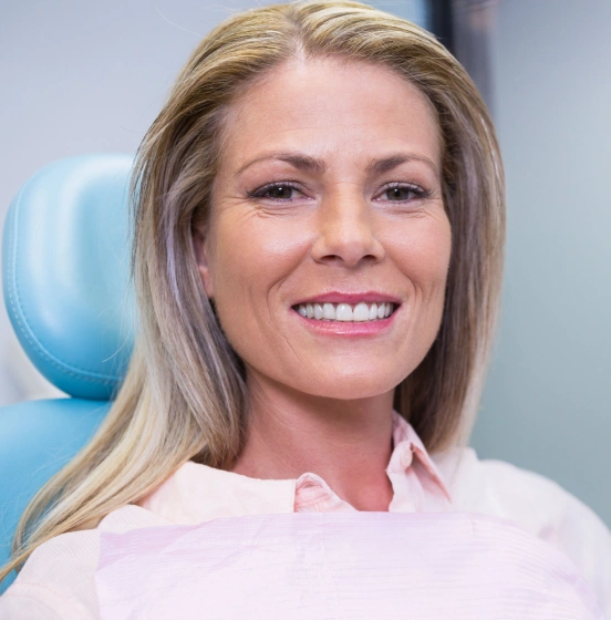 Woman smiling after periodontal therapy for healthier gums