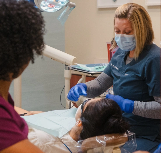 Dentist performing a tooth extraction procedure